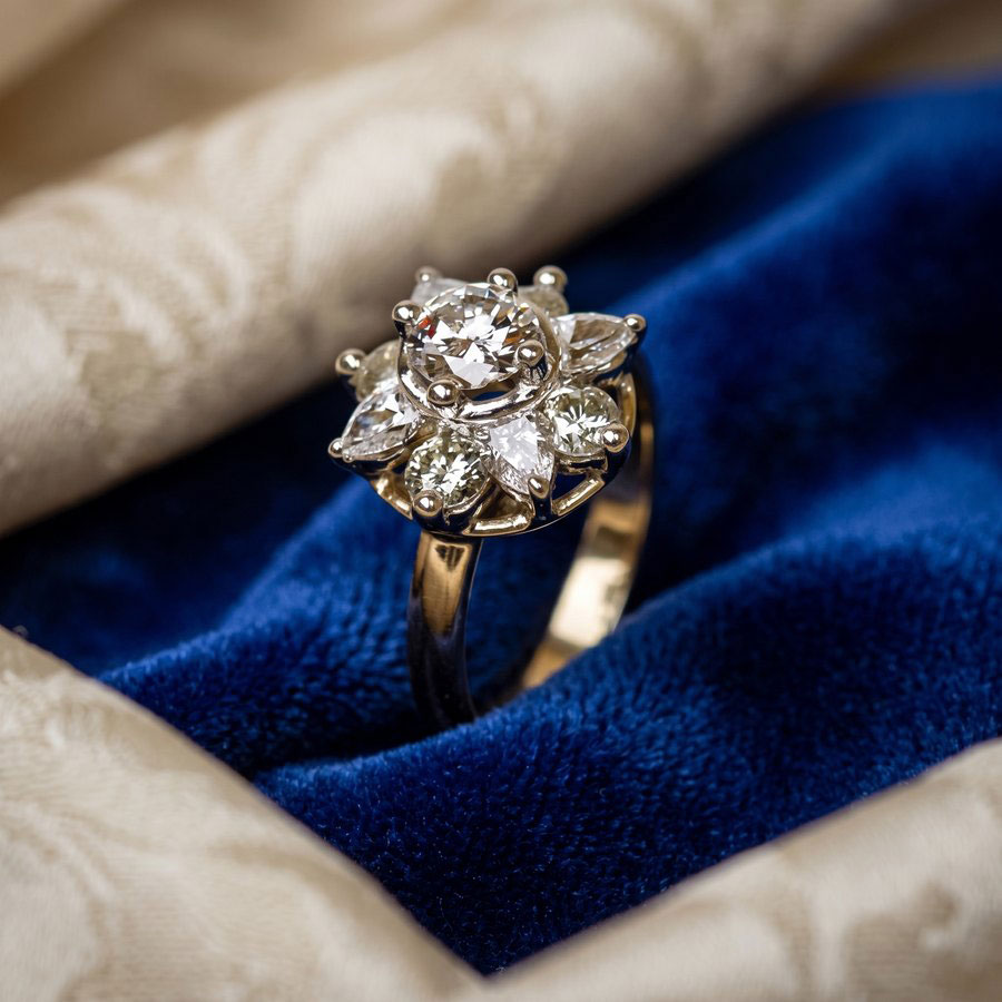 Custom diamond cluster engagement ring on blue velvet Custom diamond cluster engagement ring on blue velvet
